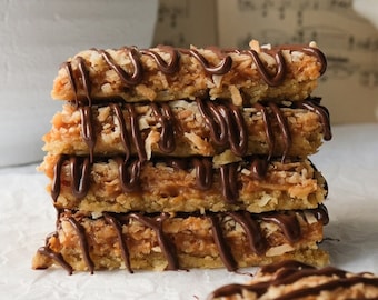 Samoas Girl Scout Cookie Bars Recipe | Caramel deLites Cookie Bars, Chewy Caramel Coconut Cookie Bars, Shortbread Base & Chocolate Stripes