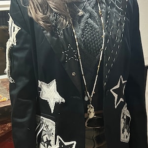 Stunning black blazer with shinning starts