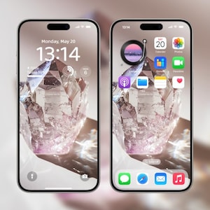 May include: A close-up of a smartphone displaying a crystal-like image on the screen. The time is 13:14 and the date is Monday, May 20. The phone has a white background and a black bezel. The screen shows a variety of apps, including Calendar, Photos, and FaceTime.