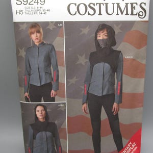 May include: Simplicity sewing pattern for a fantasy or cosplay costume. The pattern includes instructions for a hooded jacket with a zipper closure and a pair of pants. The pattern is for sizes 6-14, 32-40, and 34-42.