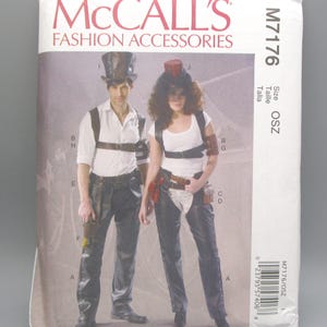 May include: A McCall's Fashion Accessories sewing pattern, M7176, featuring two people in steampunk-inspired outfits. The pattern includes instructions for a top hat, leather-look pants, and accessories. The cover has the text "McCall's Fashion Accessories".