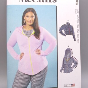 May include: A McCall's sewing pattern featuring a woman wearing a pink hooded jacket with a yellow zipper, and houndstooth pants. The pattern includes multiple view options. The size is W3 (30W-32W-34W-36W-38W). Designed and printed in the USA.
