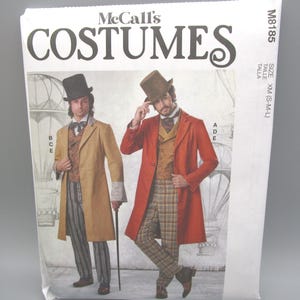 May include: A McCall's costume pattern package featuring two men in Victorian-era outfits. The package has the word "COSTUMES" in large letters. The men are wearing long coats, vests, and top hats. The package is white with the pattern number M8185.