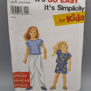 May include: A sewing pattern for children's clothing. The pattern features two young girls wearing different outfits. One outfit is a striped top and white pants, and the other is a blue floral top and shorts. The text on the pattern reads "It's SO EASY...for Kids."