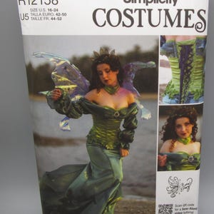 May include: Simplicity Costumes pattern R12158. The package features a woman in a green fairy costume with wings. The costume includes a green bodice, a long skirt, and a crown. The package also includes images of the costume's details.