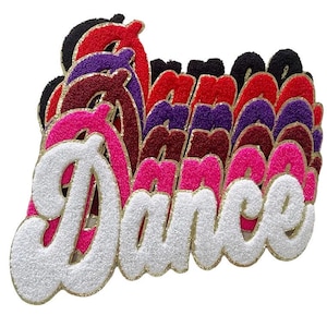 May include: A stack of colorful felt "Dance" patches with a white glitter outline. The patches are in various shades of pink, red, purple, and black.