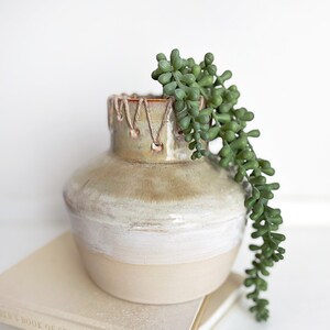 handmade ceramic vase glazed in a gray/green glaze