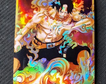 May include: Holographic trading card featuring a muscular character with black hair and a beaded necklace. The character is surrounded by colorful flames and smoke. He is wearing black shorts and a belt. The card has a shiny, iridescent finish.