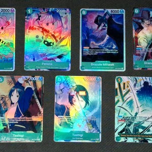 May include: Seven collectible trading cards featuring anime-style illustrations. The cards display characters like Perona, Dracule Mihawk, and Tashigi, with holographic foil backgrounds. Each card has a character name and a numerical value.
