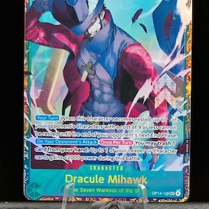 May include: A trading card featuring Dracule Mihawk from the Seven Warlords of the Sea. The card has a teal background with a character illustration in red, blue, and white. The card has text that reads "10000" and "9".
