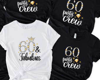 May include: Six black t-shirts with white text that says "60 party crew" and a white t-shirt with white text that says "60 & Fabulous". All shirts have gold glitter accents.