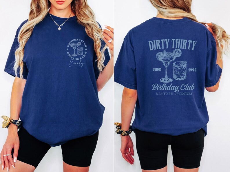 May include: Navy blue t-shirt with front and back graphics. The front has a cocktail design and the text "Birthday Club Dirty 30's Era Emily". The back shows "Dirty Thirty", cocktail graphics, the date "June 1995", and "Birthday Club R.I.P. to my twenties".