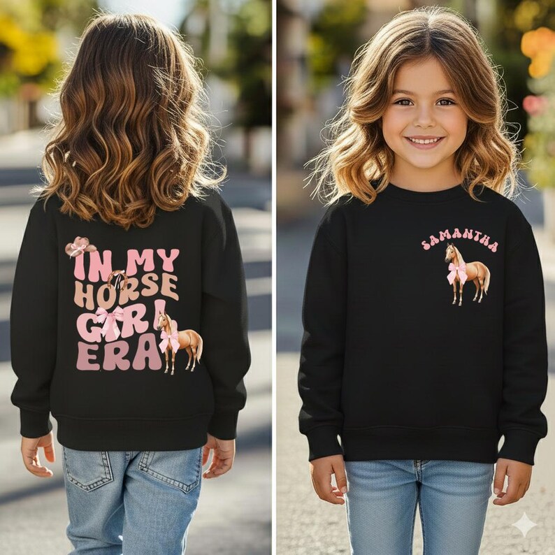 May include: Black sweatshirt with the text "IN MY HORSE GIRL ERA" and a horse graphic on the back. The front of the sweatshirt has the name "Samantha" and a horse graphic. The sweatshirt is worn by a young girl.