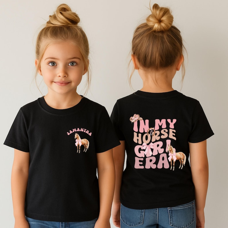 May include: Two black t-shirts with a horse graphic. One shirt has the name "Samantha" above the horse. The other shirt says "In My Horse Girl Era" with a horse graphic. Both shirts have a pink bow.