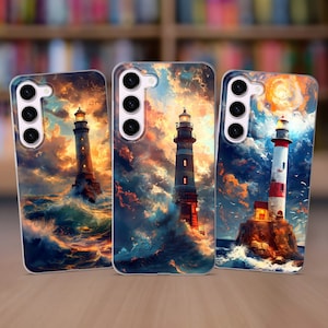May include: Three phone cases with a lighthouse design. The cases are clear and show a colorful image of a lighthouse on a stormy sea. The lighthouses are white with red stripes and are lit up at night.