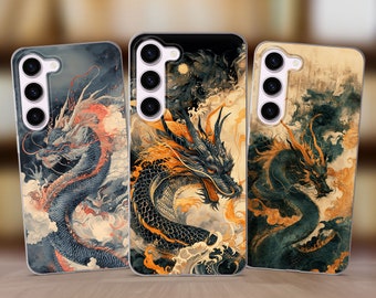 May include: Three phone cases with a black and gold dragon design. The dragons are depicted in a swirling, cloud-like pattern with a Japanese-inspired aesthetic.