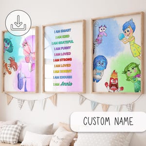 May include: Three framed art prints featuring characters from the film "Inside Out." One print has text that reads "I AM SMART, I AM KIND, I AM GRATEFUL, I AM FUNNY, I AM LOVED, I AM STRONG, I AM LOVED, I AM HONEST, I AM ENOUGH, I AM Annie." The other two prints feature the characters.