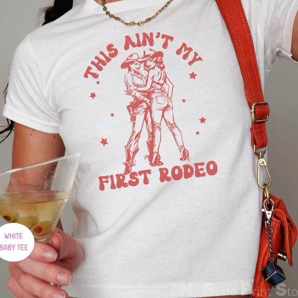 This Aint My First Rodeo Baby Tee Shirt Western WLW Sapphic Lesbian Cowgirl Shirt Bi Gay Pride Crop Top Bisexual Femme Subtle Queer T-shirt