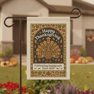 May include: Thanksgiving garden flag featuring a stylized turkey with a colorful tail. The flag has the words "Happy Thanksgiving" and "Celebrating Immigrants Since 1620" in a decorative frame. The flag is displayed on a black metal stand.