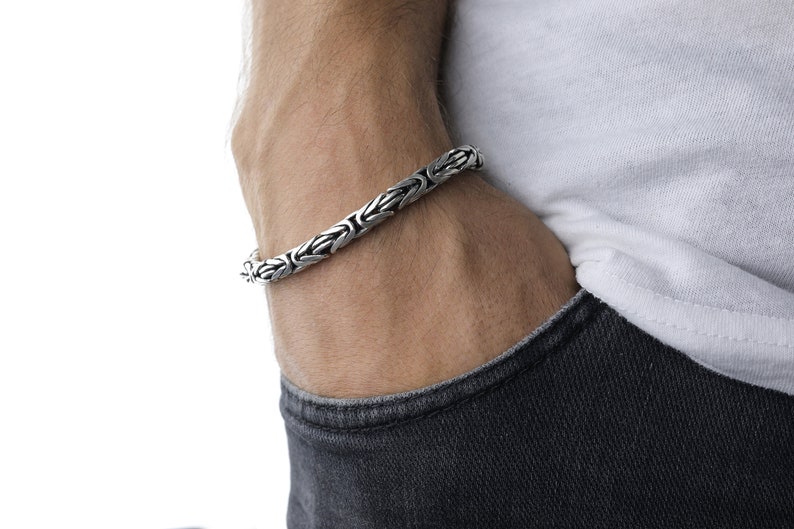 This bracelet is crafted from high-quality 925 sterling silver and has a thick chain. The bracelet is specially designed for men and has round shape.