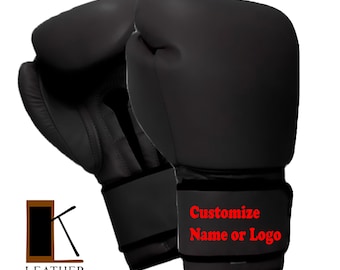May include: A pair of black boxing gloves with the text "Customize Name or Logo" in red. The gloves have a wrist strap and the Leather Kingdom logo is visible on the left side.