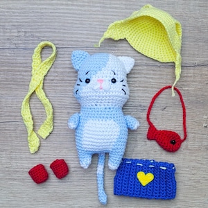 Cat in Boots Crochet Pattern. Puss in Boots. Kitten Amigurumi with Hat, Fish Bag, Sweater, Scarf, Bed, Blanket and Red Shoes as Accessories.