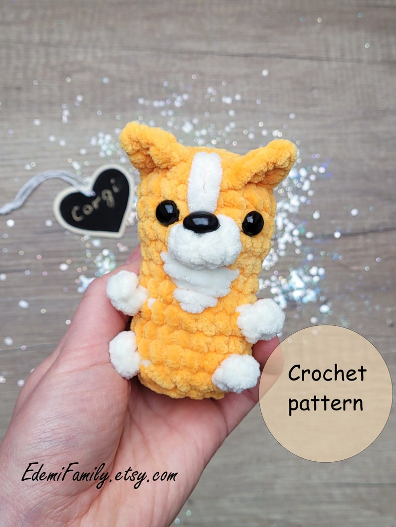 Soft, plush corgi keychain featuring orange fur with white accents and adorable black button eyes.