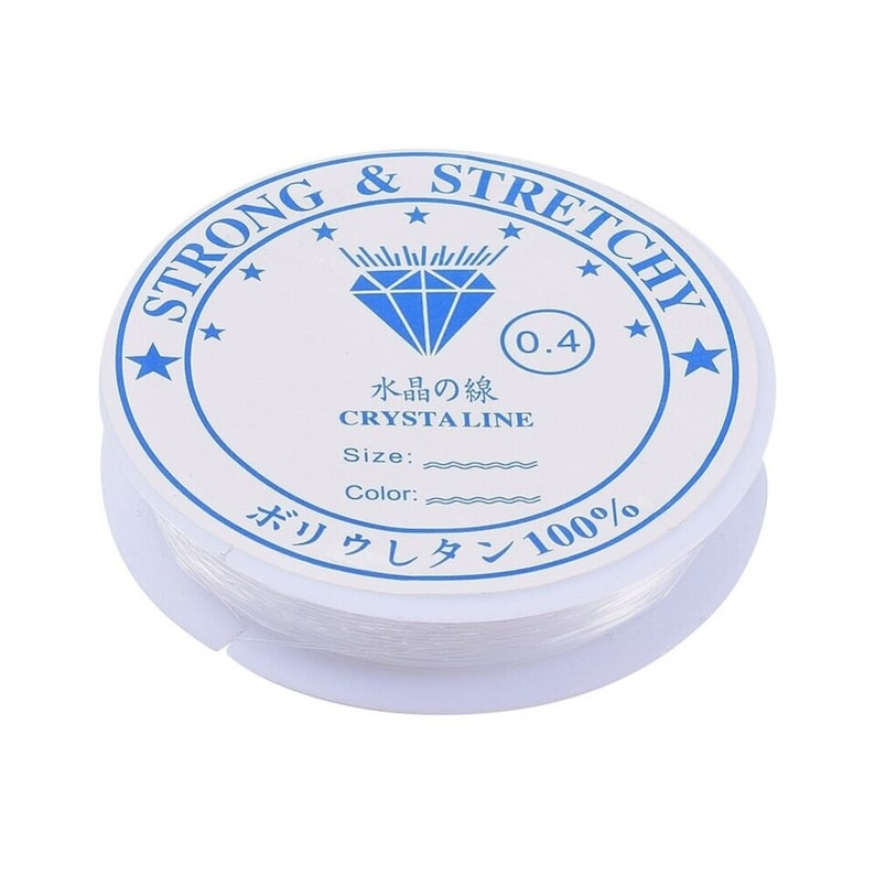 May include: A spool of clear, stretchy beading cord. The white label reads "STRONG & STRETCHY" in a blue circular design. Text on the label includes "CRYSTAL LINE" and "0.4". The cord is made of 100% polyurethane.
