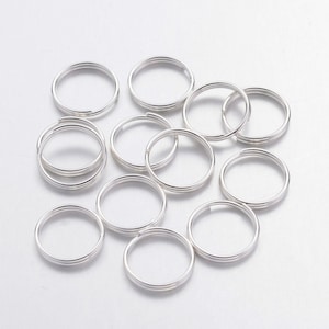 May include: A set of 12 silver jump rings, ideal for jewellery making or crafting projects.