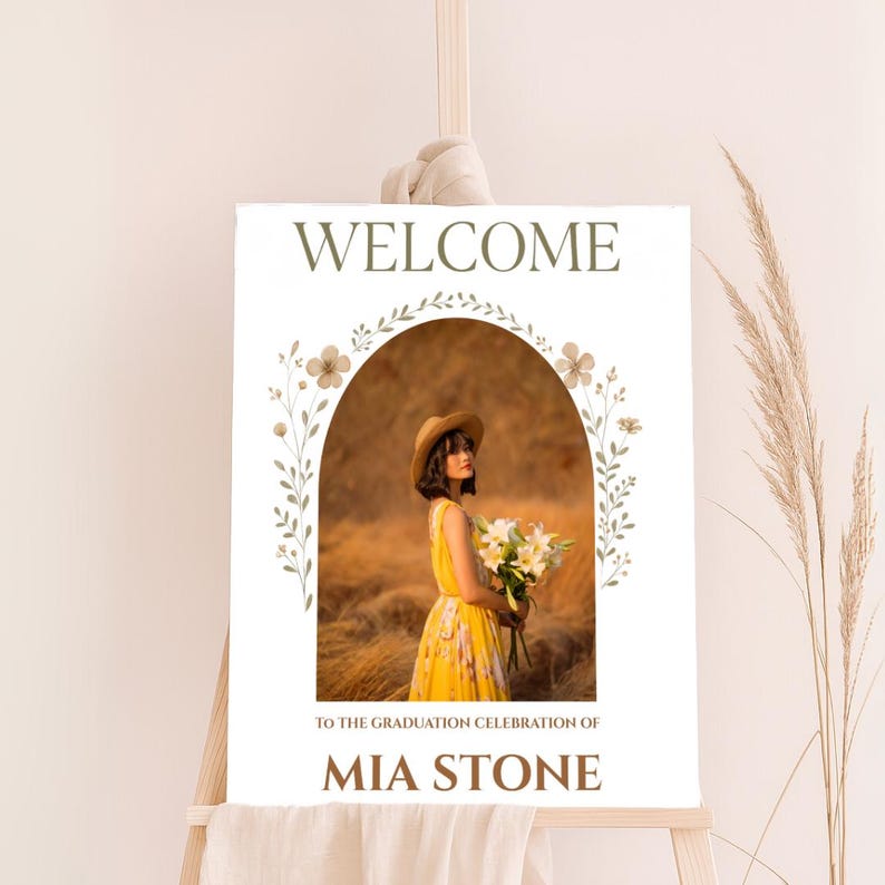Elegant graduation welcome sign featuring a young woman in a yellow floral dress with a bouquet, framed by botanical accents. Customizable Canva template in neutral tones, perfect for rustic or boho-themed celebrations.