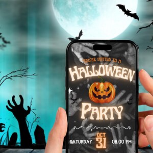 May include: A smartphone displays a Halloween party invitation against a spooky backdrop. The invitation features a glowing jack-o'-lantern, the text "Halloween Party," and the date, October 31st. The background includes a full moon, bats, and zombie hands.