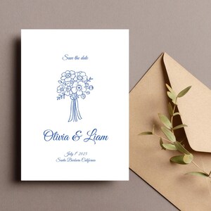 Puede incluir: Tarjeta de guardar la fecha con una ilustraci&oacute;n floral azul y el texto "Olivia & Liam"  "1 de julio de 2025" "Santa Barbara, California"