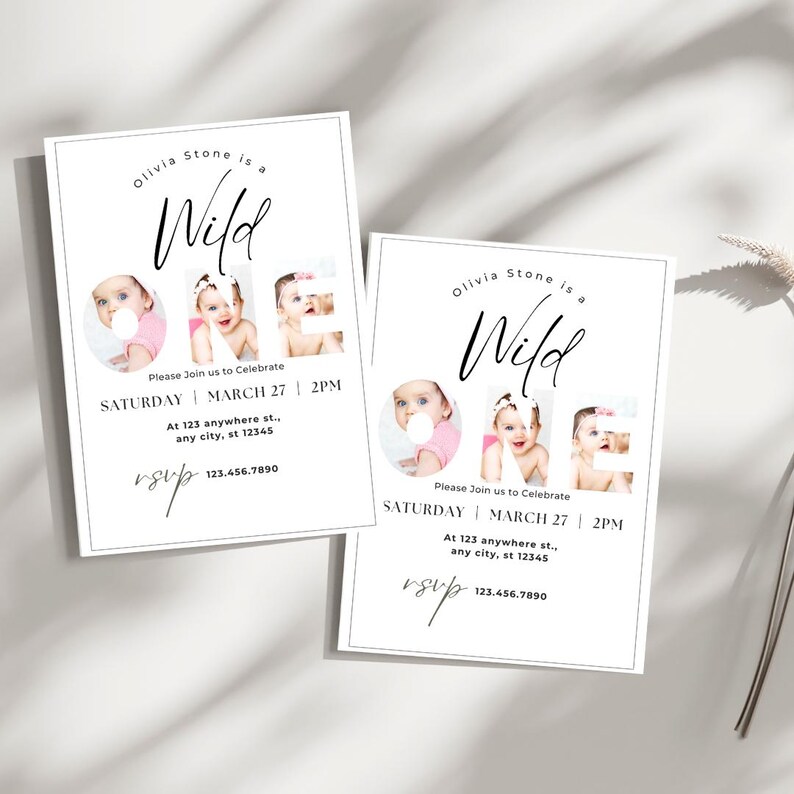 May include: Two white invitations with black text. The text reads "Olivia Stone is a Wild ONE." The word "ONE" is formed by three photos of a baby. The invitations include event details and an RSVP.