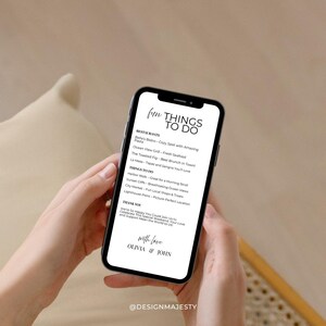 K&ouml;nnte beinhalten: Ein Smartphone zeigt eine Liste mit dem Titel "Fun Things To Do". Die Liste enth&auml;lt Restaurantempfehlungen und Aktivit&auml;ten wie Harbor Walk und Sunset Cliffs. Unten auf dem Bildschirm steht "with love, Olivia & John."