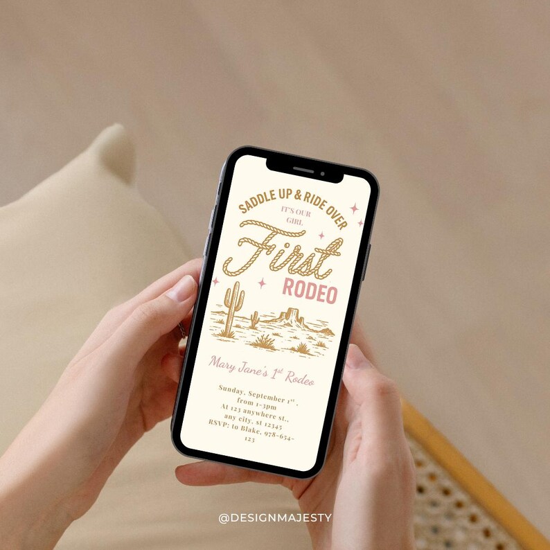 May include: A smartphone displays a rodeo-themed invitation. The design features the text "Saddle Up & Ride Over" and "First Rodeo" in a decorative font, along with a desert landscape illustration. The invitation includes event details.