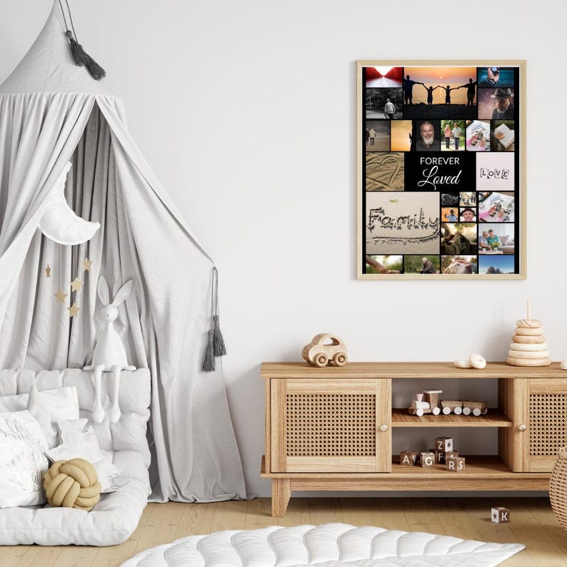 May include: A framed photo collage with multiple images, including the words "Forever Loved" and "Family". The collage is in a light-colored wooden frame. The images are of people and landscapes. The collage is hanging on a white wall.