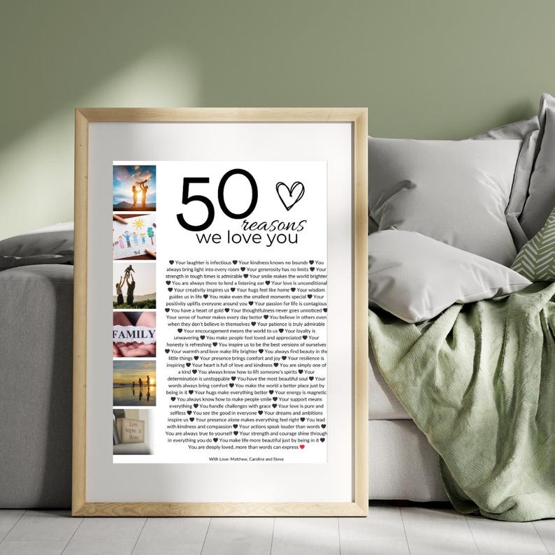 May include: A framed print with a white background and black text. The text reads "50 reasons we love you" and lists 50 reasons why someone is loved. The print includes several small photos of people and places.