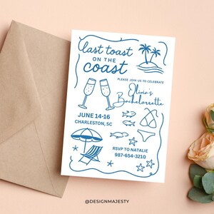 May include: A white invitation with blue illustrations and text for a bachelorette party. The design includes champagne glasses, a beach scene, and the text "Last toast on the coast". The invitation is accompanied by a brown envelope.