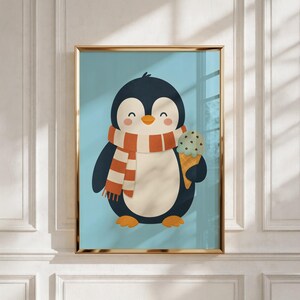 May include: A framed wall art print featuring a cartoon penguin with a dark blue body, a white belly, and orange feet. The penguin wears a striped orange and white scarf and holds a light green ice cream cone with dark chocolate chips.