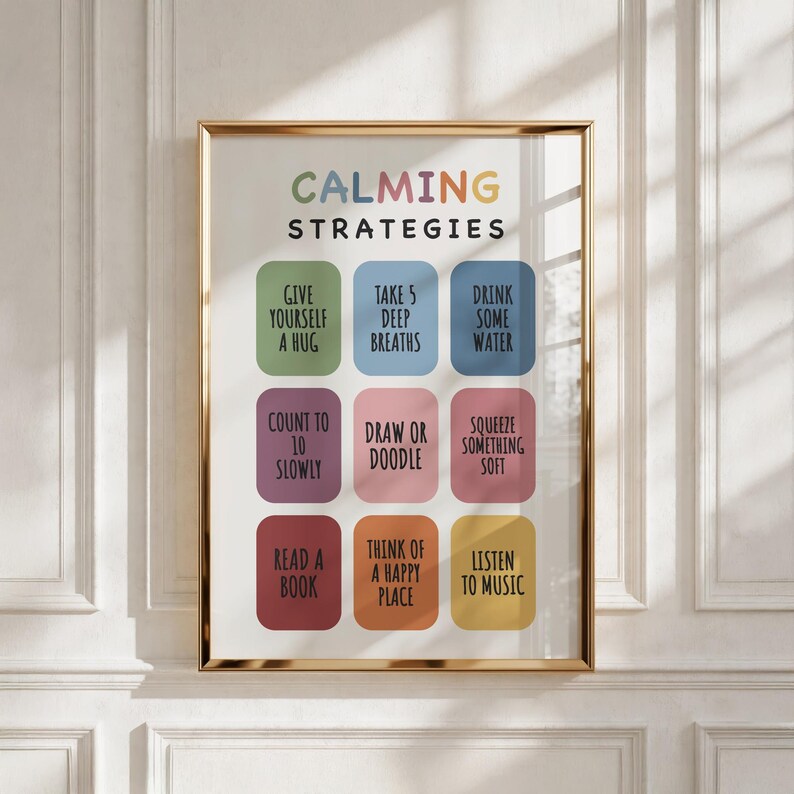 May include: A framed wall art print titled CALMING STRATEGIES in multicolored letters. It features nine rounded rectangles in green, blue, purple, pink, red, orange, and yellow, each containing black text listing coping activities like take 5 deep breaths.