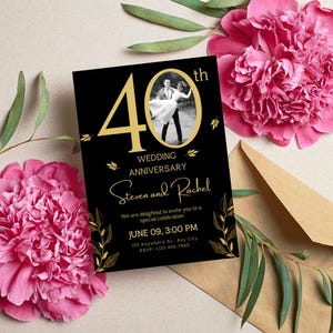 May include: Black and gold wedding anniversary invitation with a photo of a couple dancing. The invitation says "40th Wedding Anniversary Steven and Rachel" and includes the date, time, and location of the event.