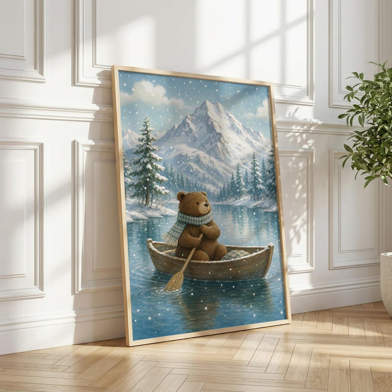 May include: A framed wall art print featuring a brown bear wearing a light blue scarf, rowing a wooden boat on a calm lake. The background displays a snowy mountain landscape with evergreen trees under a light snowfall, captured in a vertical orientation.