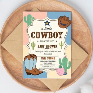 May include: A baby shower invitation with a cowboy theme. The invitation is pink and blue with a cactus and cowboy hat design. The text reads "a little cowboy is on the way!" and includes details for the event, including the date, time, location, and RSVP information.