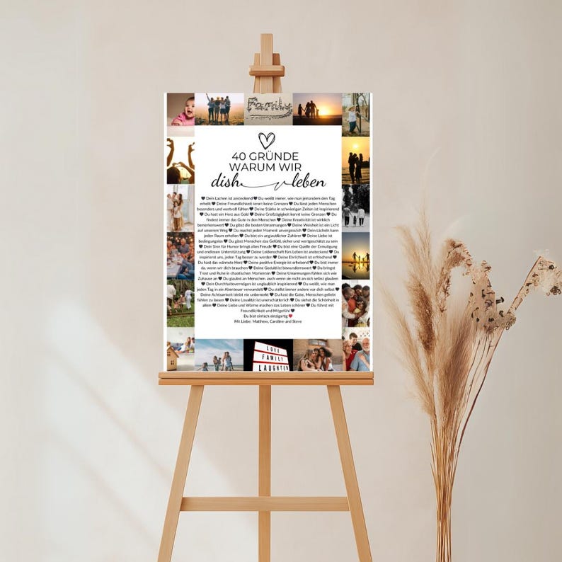 May include: A framed collage on an easel, featuring multiple photos and text in German. The text reads "40 Gr&uuml;nde Warum Wir Dish Leben" with a heart symbol. The photos depict various people and scenes.