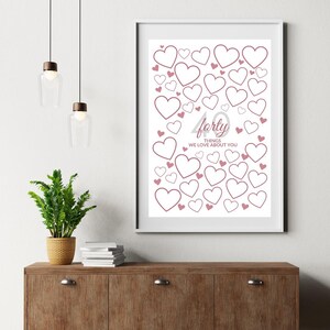 May include: A framed print with a white background, featuring numerous heart outlines in varying sizes. The text "forty things we love about you" is displayed in a soft pink hue, suitable for a birthday or anniversary gift.