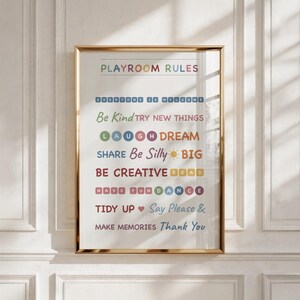 May include: A framed wall art print titled PLAYROOM RULES in multicolored letters. The text includes: EVERYONE IS WELCOME, Be Kind, TRY NEW THINGS, LAUGH, DREAM, SHARE, Be Silly, BIG, BE CREATIVE, READ, HAVE FUN, DANCE, TIDY UP, Say Please & Thank You.