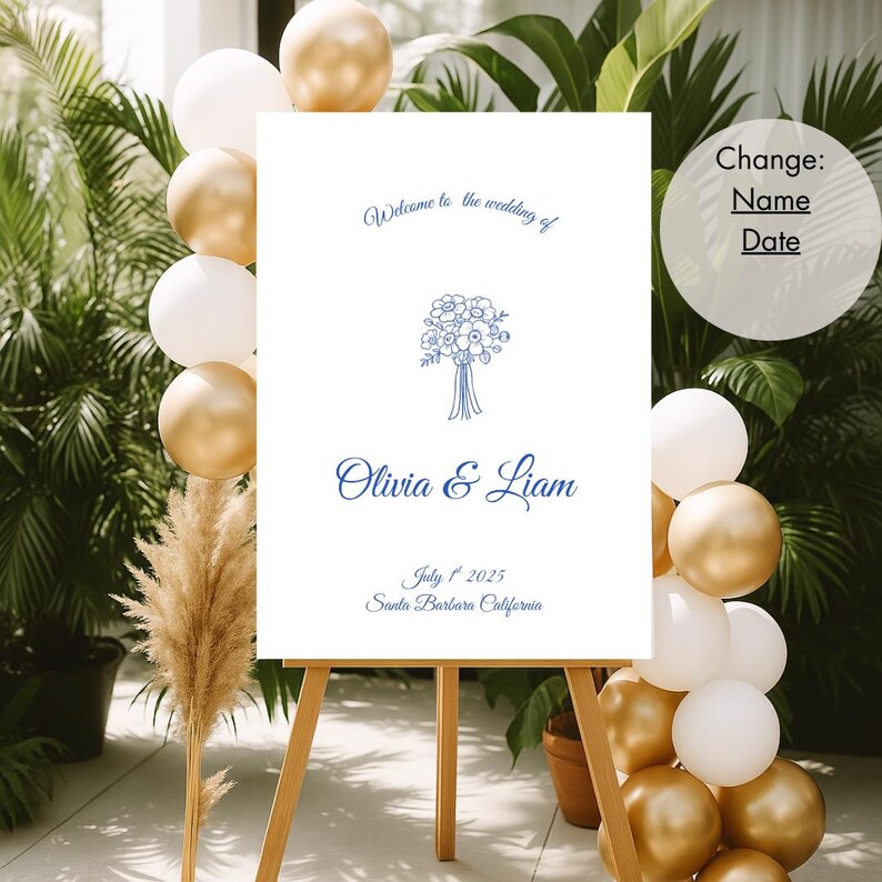May include: A white wedding welcome sign on a wooden easel, with blue script that reads "Welcome to the wedding of Olivia & Liam" and the date "July 1, 2025". The sign is decorated with a floral bouquet illustration. Gold and white balloons are arranged around the sign.