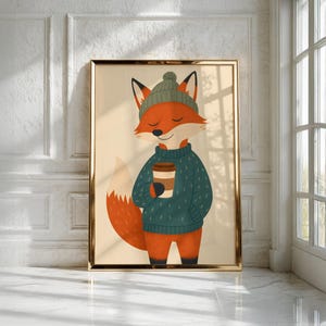 May include: A framed wall art print featuring a stylized orange fox wearing a dark green knit beanie and a matching dark green sweater. The fox has its eyes closed and is holding a brown coffee cup with both hands against a light beige background.