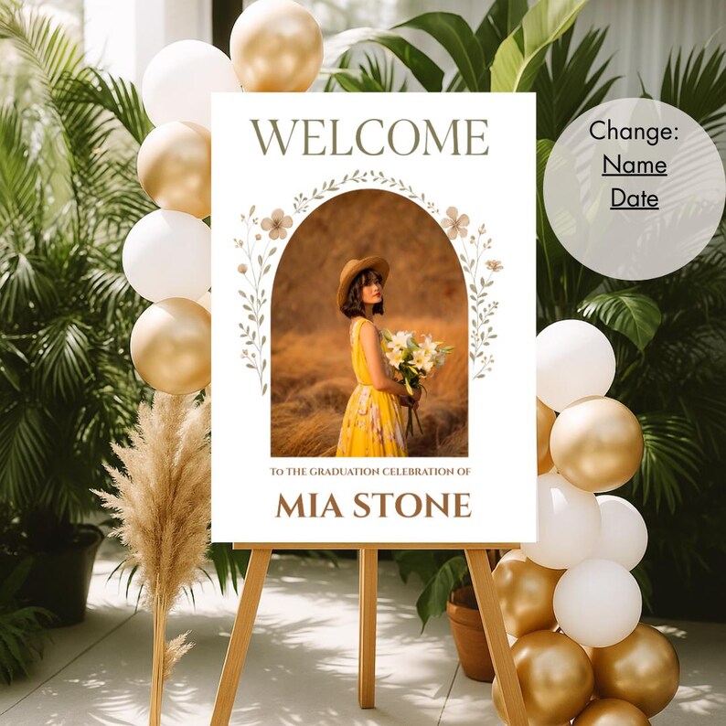 May include: Welcome sign with a floral arch and a photo of a person in a yellow dress. The sign says "Welcome to the graduation celebration of Mia Stone".