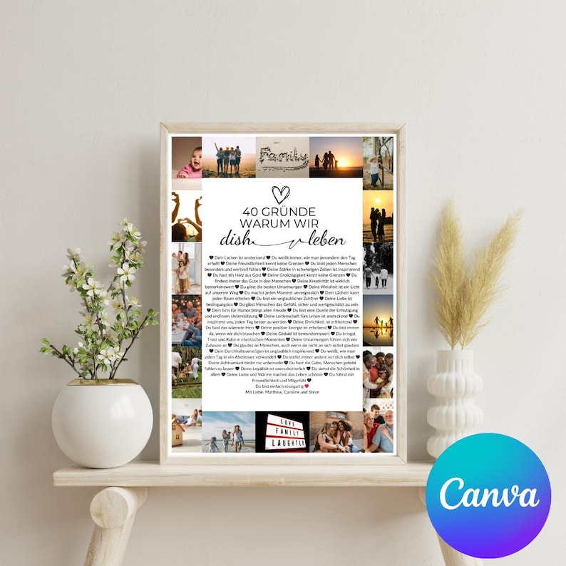 May include: A framed print with the text "40 Gr&uuml;nde warum wir dish leben" in German, surrounded by small photos. The print is displayed on a white shelf with a white vase and a plant in a white pot. The background is a light beige.
